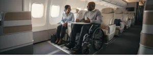 Wheelchair user sat next to a female while chatting on an airplane