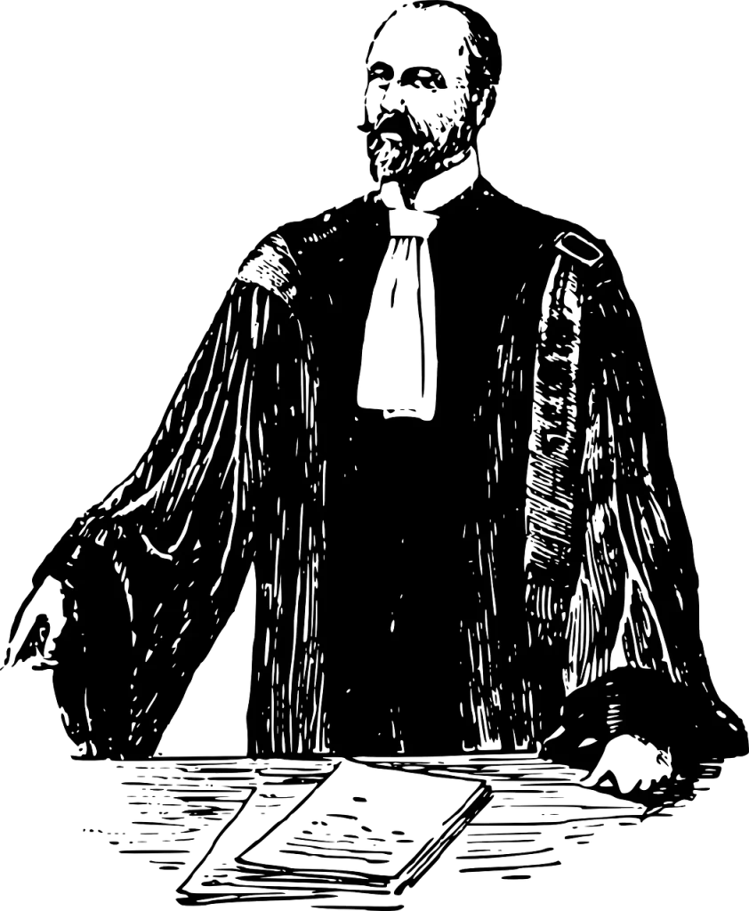 Lawyer in a black robe standing at a desk